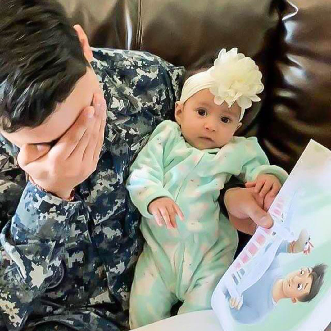 Dads return from deployment to read a personalized book to their daughters