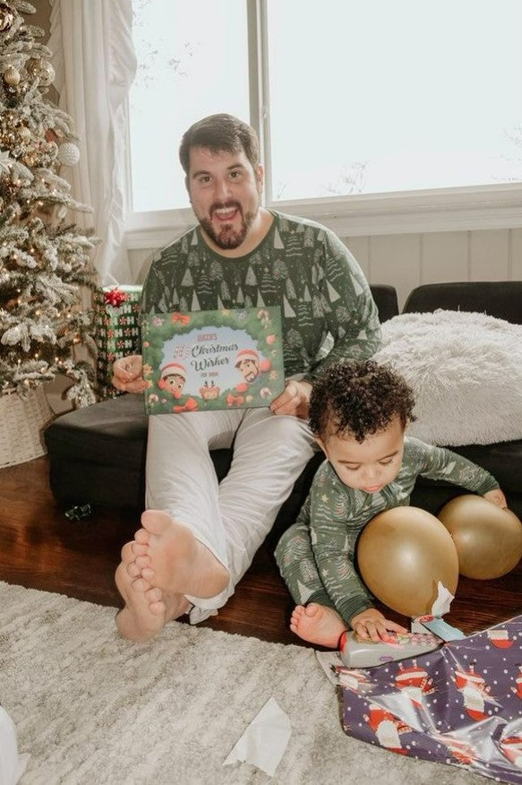 A dad happy after receiving a personalized Christmas book for him and his child as an Xmas gift.