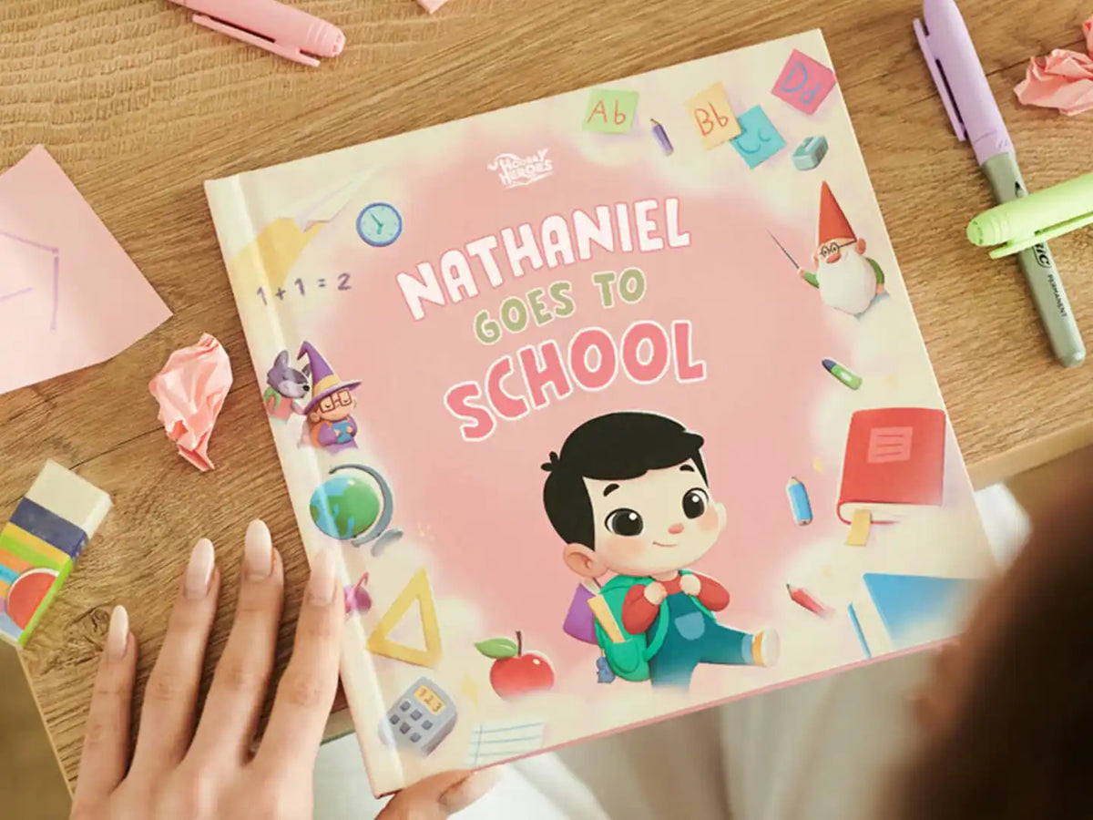 Personalized book about going back to school on the table with pens and paper. 