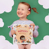 Little girl is smiling while holding this awesome gift for her baby brother, Lincoln's nursery rhymes by Hooray Heroes.