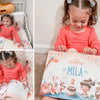 Little girl is so happy she received a custom book for her second birthday from Hooray Heroes.