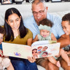 A family of grandparents and grandkids reading their best personalized book for granny and grandpa.