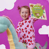 Little dinosaur lover Robyn is holding her new, awesome personalized book about herself and dinos.