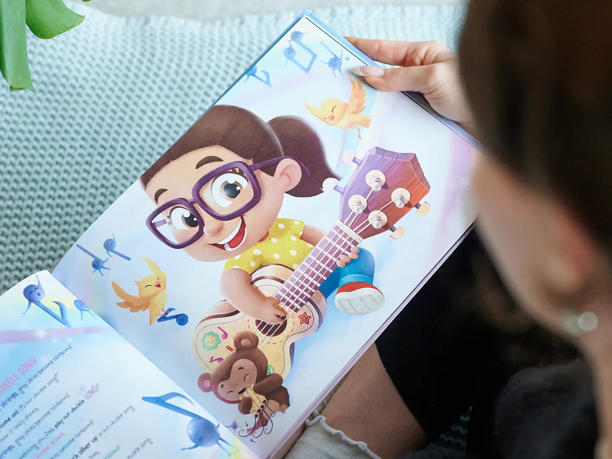 Fun illustration of a girl playing guitar from our custom dad book for Christmas.