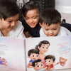 Three boys lying on the floor and reading their DIY book for them and mom they got as a birthday present.