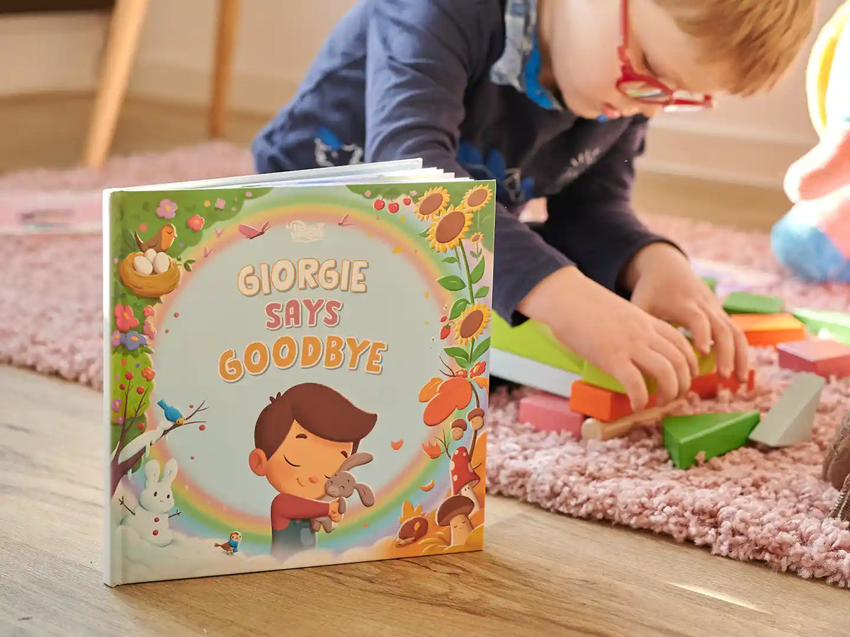A boy with his custom grieving book to help cope with death.