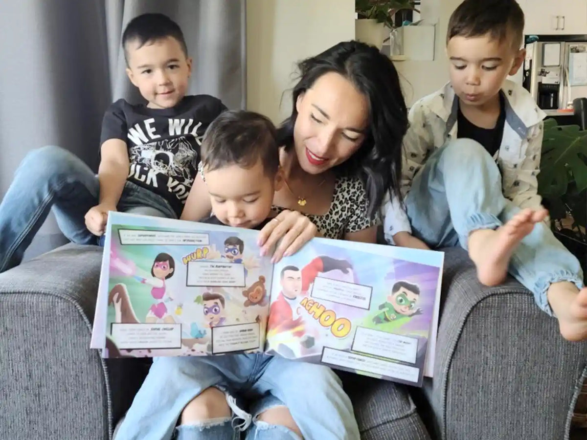 Mom and her three kids are looking at the illustration inside the custom family book which is a great gift for three kids.