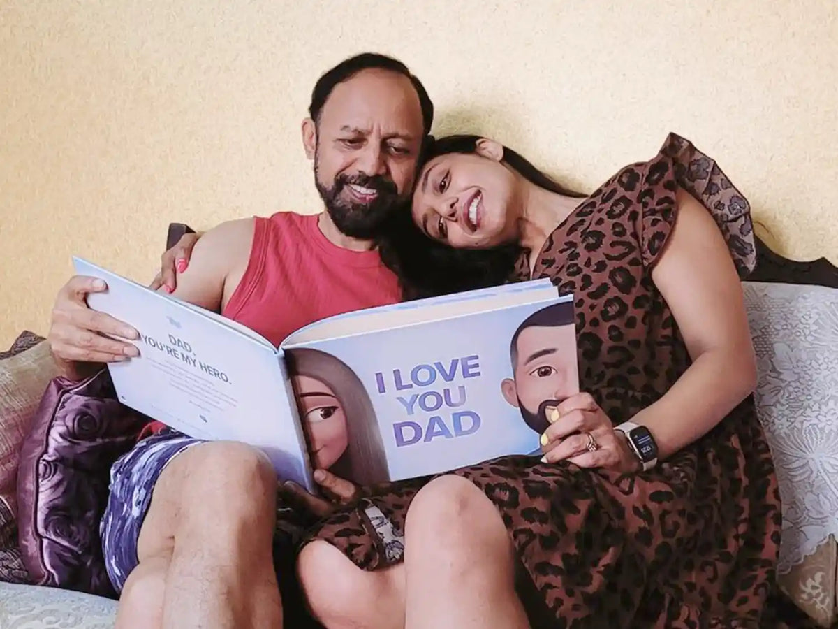 Woman and her dad enjoy reading their personalized dad book.