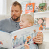 Daddy and baby reading their very own custom book all about what he or she may grow up to be.