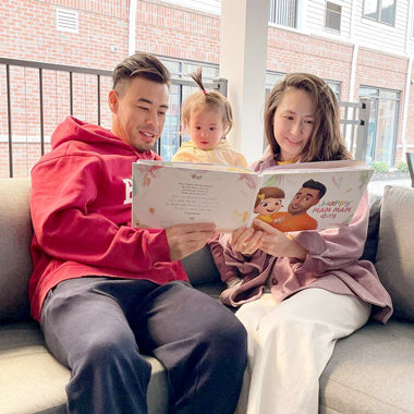 A young family reading a personalized mom book for Mother's Day.