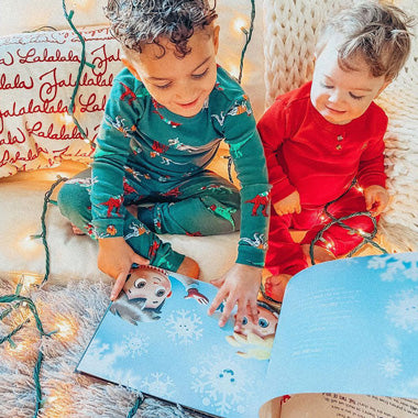 Kids read through their new DIY Xmas book for siblings and go on magical Christmas adventures together.
