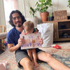 Father and daughter receiving a personalized book imagining what job she could have when she grows up.