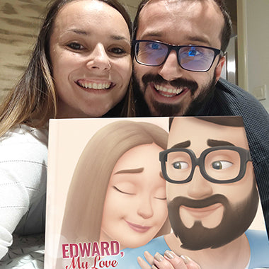 A husband and wife smiling with their customized love book, the best gift for him.