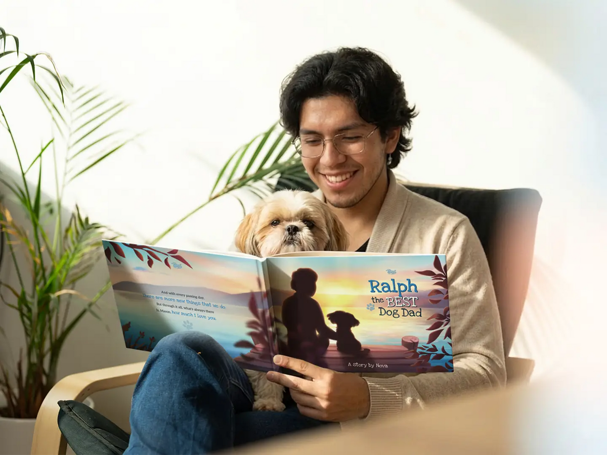 Man reading his custom 'Best Dog Dad' book with his dog — a unique and emotional gift for dog dads.