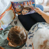 A grandma and her grandson reading their personalized book starring them as the characters.