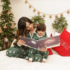 Mommy and daughter read a personalised Hooray Heroes Xmas book for one kid together.