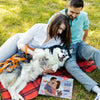 Couple cuddling with their dog and personalized love book – perfect gift for couples and pet lovers.