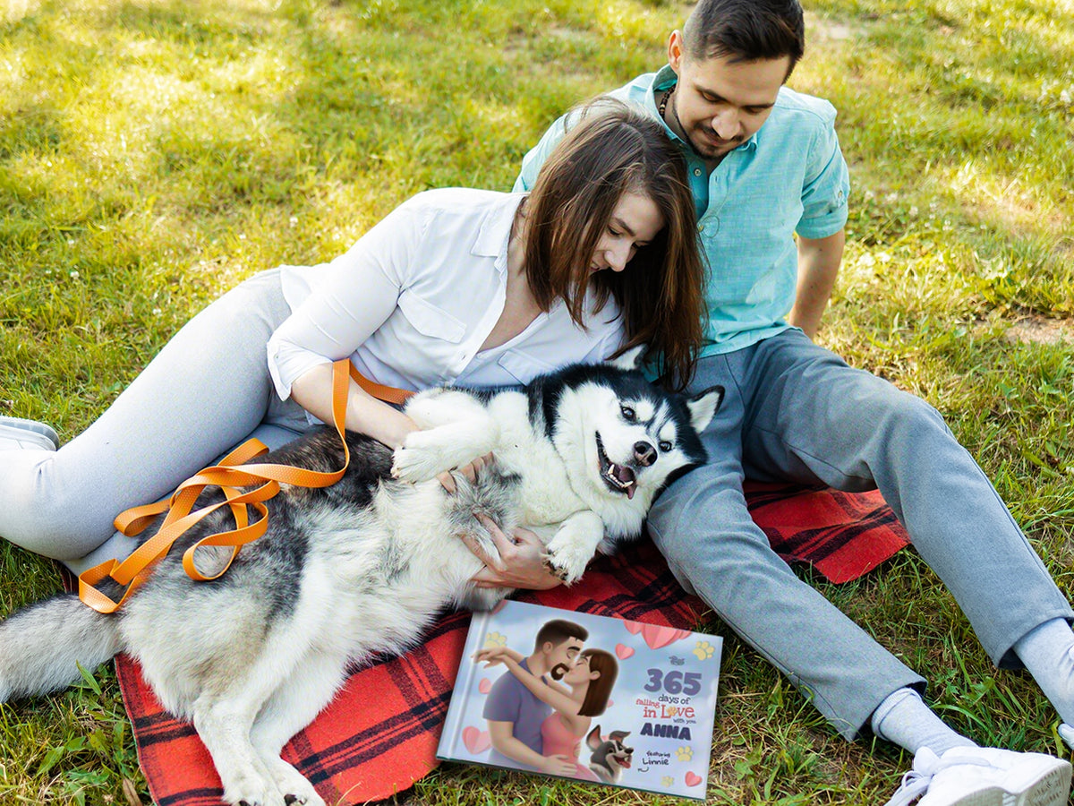Couple cuddling with their dog and personalized love book – perfect gift for couples and pet lovers.