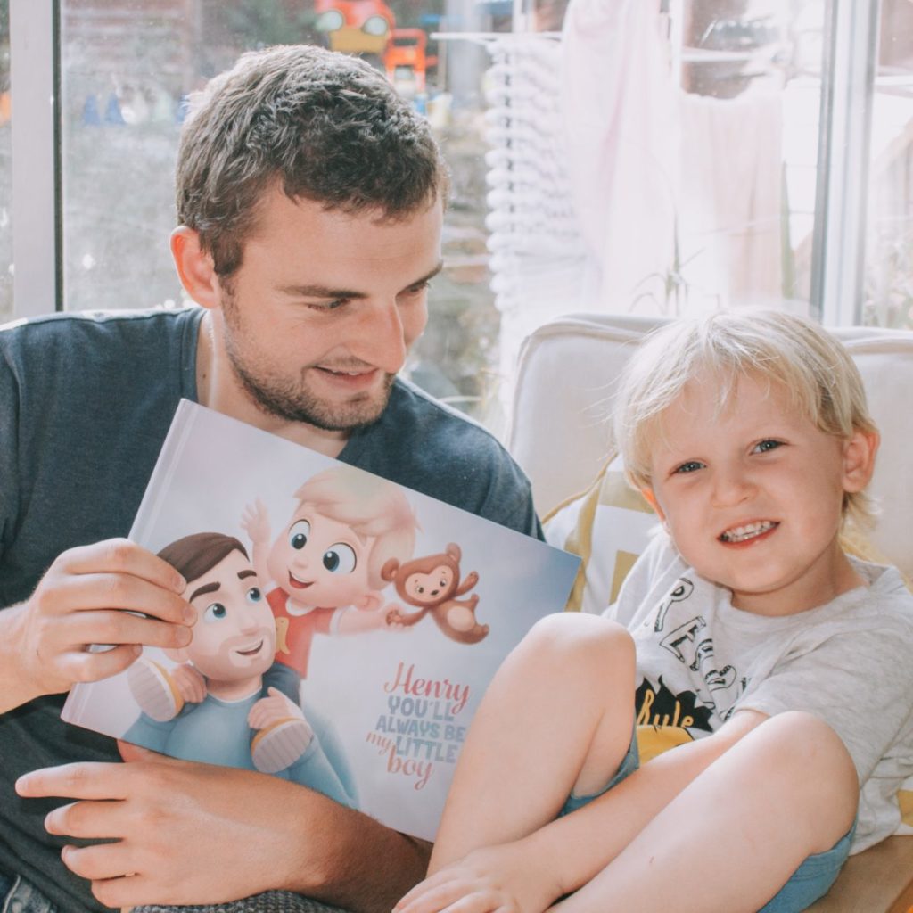 Daddy and son reading together Hooray Heroes' personalized Always LittleBook