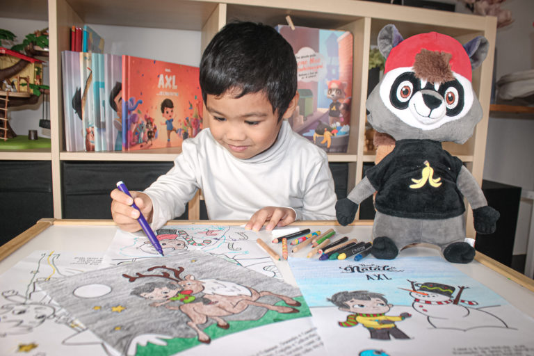A little boy coloring-in Hooray Heroes All Seasons Free Printable.