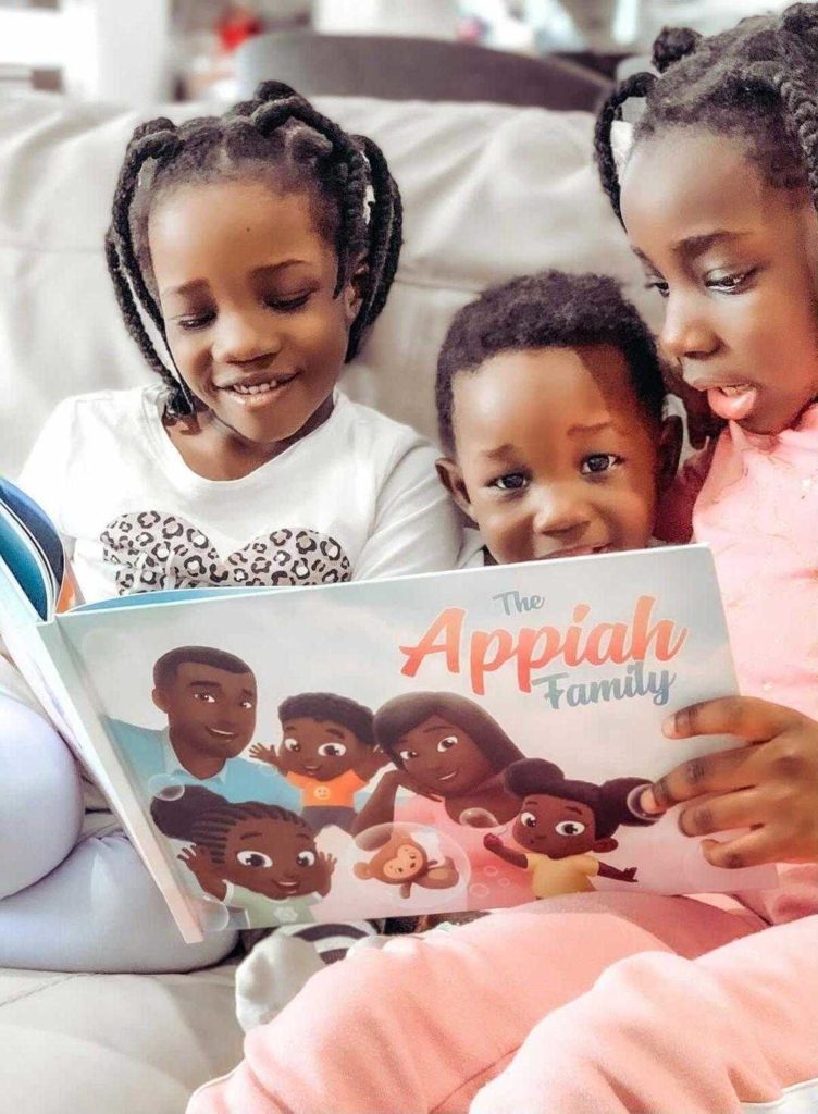 Three girls reading their personalized siblings book
