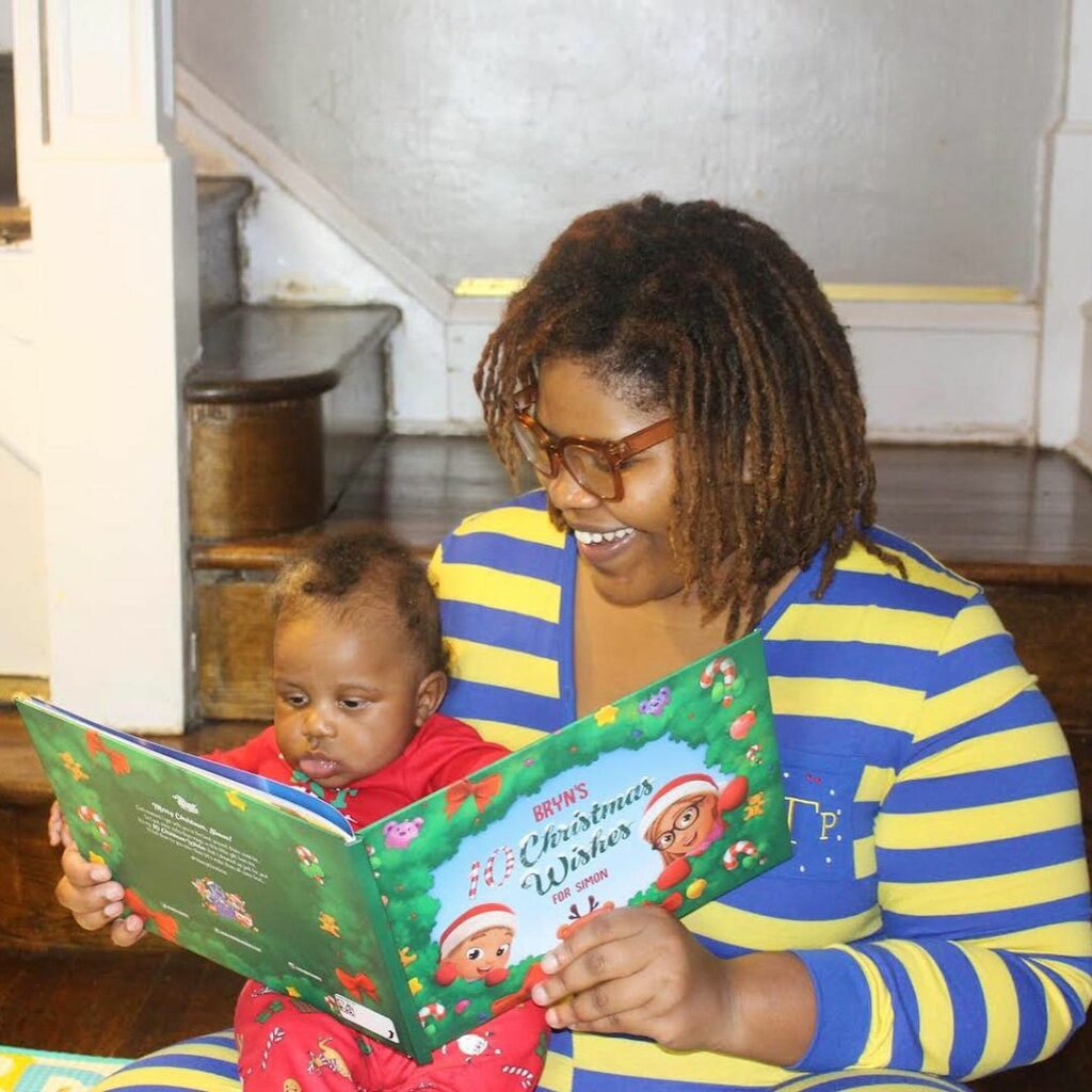 A mother and child reading the personalized Christmas book from Hooray Heroes. 