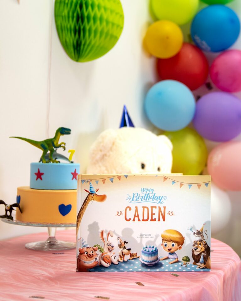 A room full of toys, balloons and a personalized birthday book by Hooray Heroes.