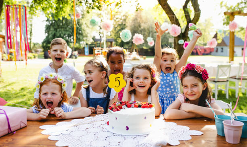 Seven children at a kid's birthday party. 