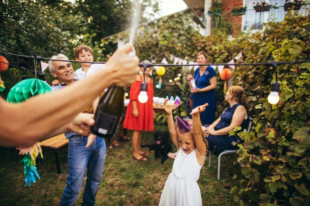 Adults having fun at a kids birthday party