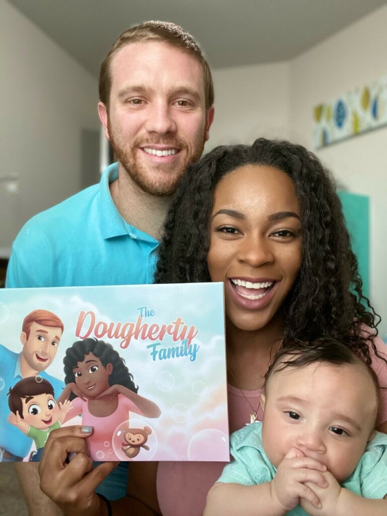 The Family of Three with a Personalized Book for Daddies from Hooray Heroes.