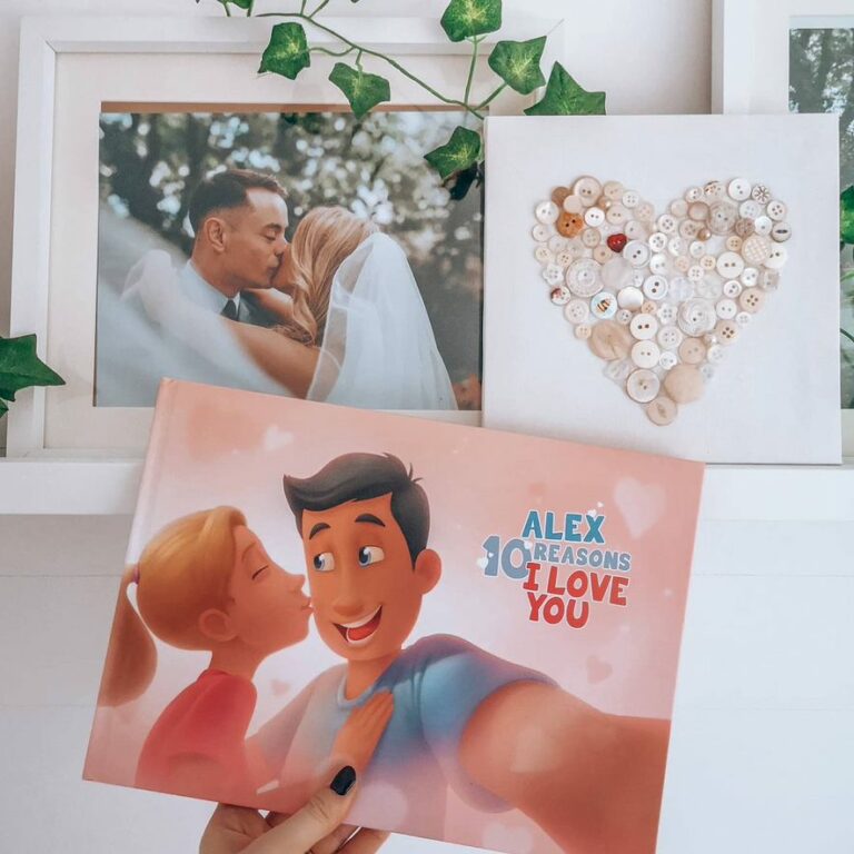 A woman holding a personalized Hooray Heroes book with a a heart and a wedding photo in the background.