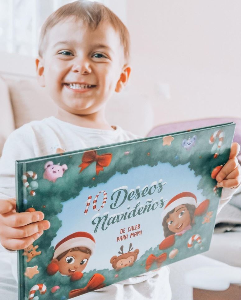 A little boy called Caleb with a personalized Christmas book for his mother.