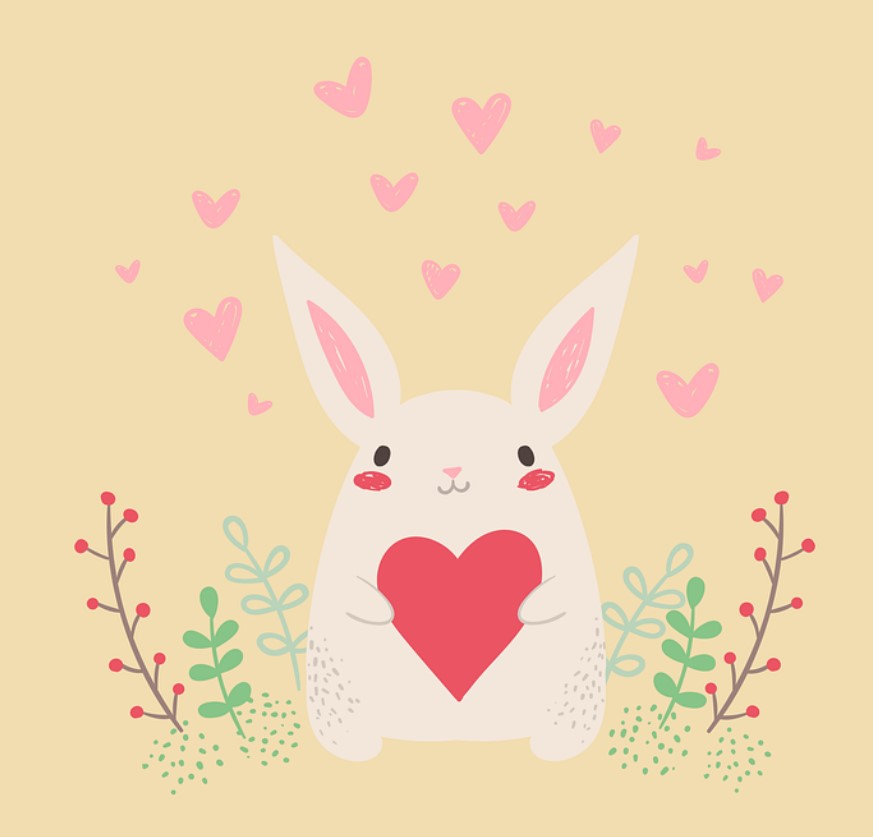 A white bunny holding and surrounding by hearts. 