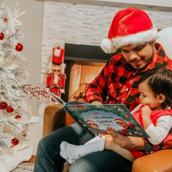 dad and child reading a personalized christmas book