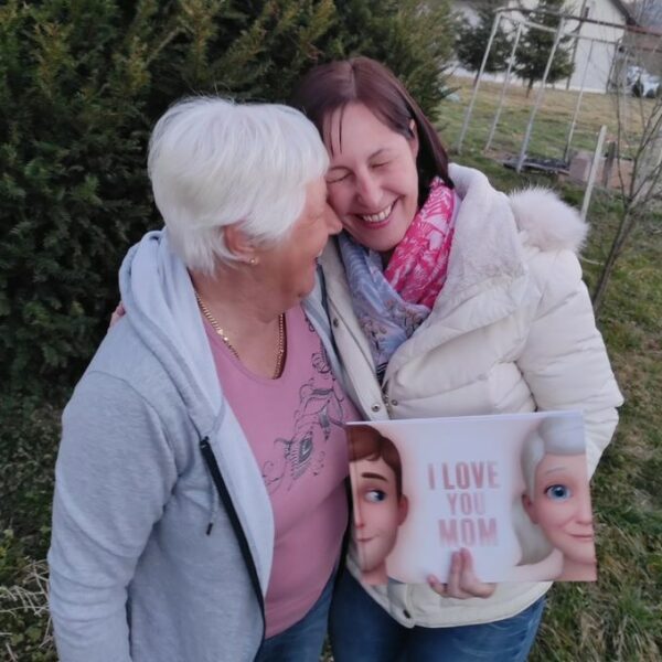 A mother and daughter bonding over a Hooray Heroes personalized book for Moms.