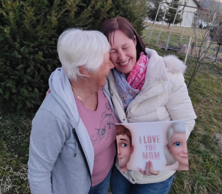 A mother and daughter bonding over a Hooray Heroes personalised book for Mums. 
