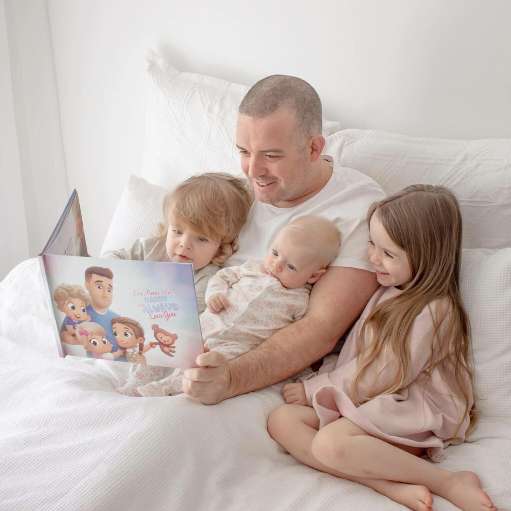 Dad reading a personalized book to his three kids