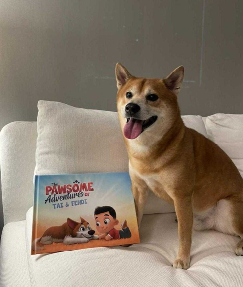 A dog with a personalized book for pets and kids from Hooray Heroes.