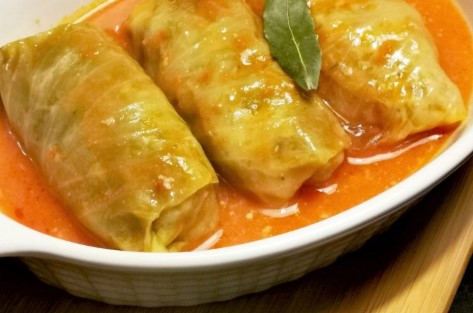 A dish filled with freshly cooked Croatian sarma or cabbage rolls.