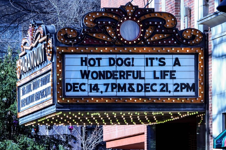A movie theater sign with showings of It's a Wonderful Life at Christmastime. 